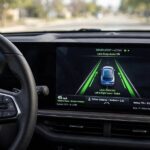 ADAS vs Autonomous Driving: What's the Real Difference? ADAS lane assistance display showing lane markings on a car dashboard