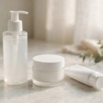 Affordable Skincare Products Celebrities Actually Use (Under $30) Assortment of affordable drugstore skincare products on a bathroom counter, cleanser moisturizer sunscreen, soft morning light, photorealistic