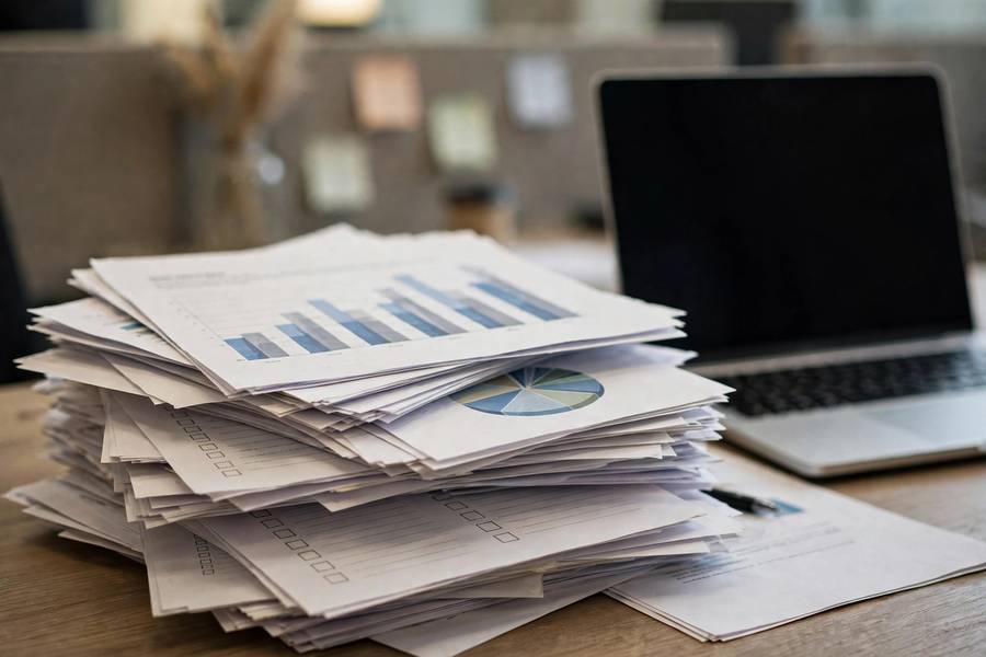 Governance framework documents and checklists on an office desk