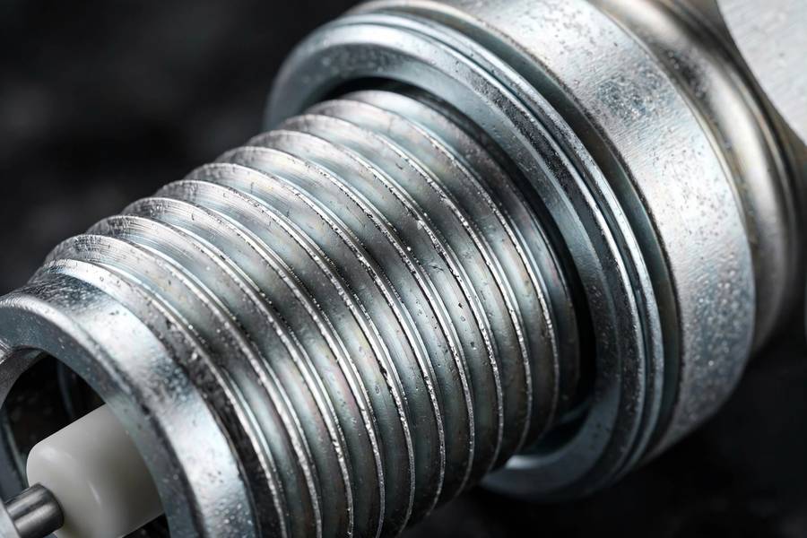 Factory anti-seize plating on modern spark plug threads