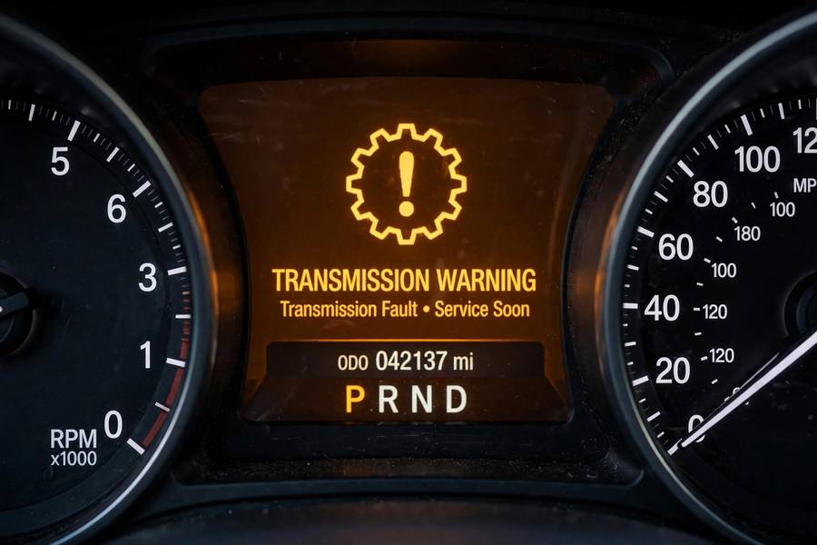 Close-up of a transmission warning light on an instrument cluster