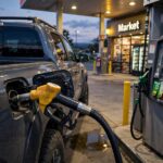 AWD vs 4WD Fuel Economy: How Much Gas Does the Drivetrain Cost? Refueling a truck, illustrating AWD vs 4WD fuel economy costs