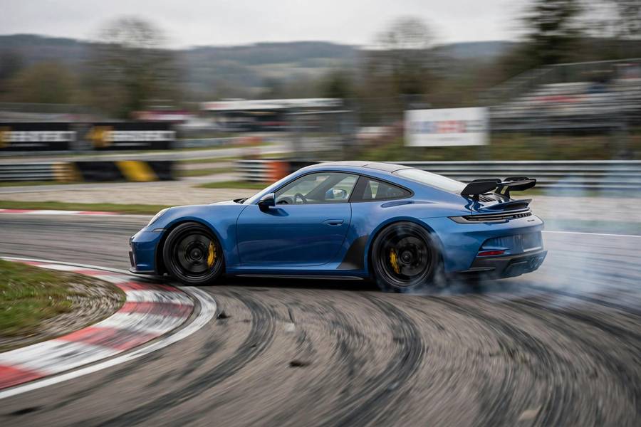 Rear-wheel drive sports car on track illustrating AWD vs FWD vs RWD differences