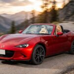Best Affordable Sports Cars: What I'd Actually Buy With My Own Money Red Mazda MX-5 Miata convertible on a mountain road, one of the best affordable sports cars