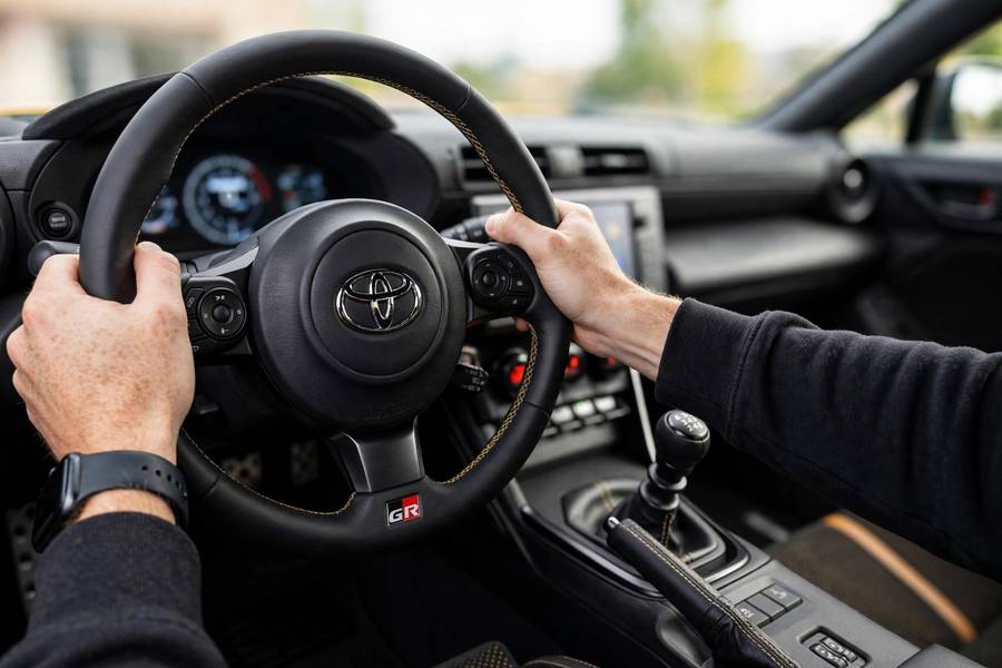 Driver cockpit view of an affordable sports car with manual transmission