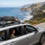10 Best American Road Trips for Families (Tested With Kids in Tow) Family car driving Pacific Coast Highway with ocean cliffs view