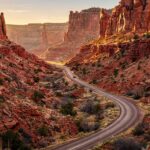Winding road through red rock canyon on a national park road trip in Utah