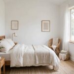 Best Paint Colors for Small Rooms (Make Any Space Feel Bigger) Small bedroom painted in soft white making it feel spacious