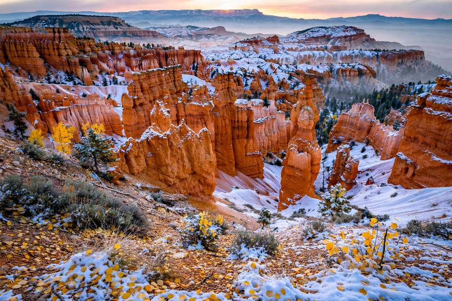 Bryce Canyon hoodoos at sunrise with autumn snow