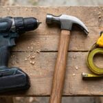 Best Tools for New Homeowners: The Essential Starter Kit Essential homeowner tool kit laid out: drill, hammer, tape measure