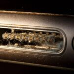 The Best Way to Clean an iPhone Charging Port Safely Close-up of an iPhone charging port needing cleaning