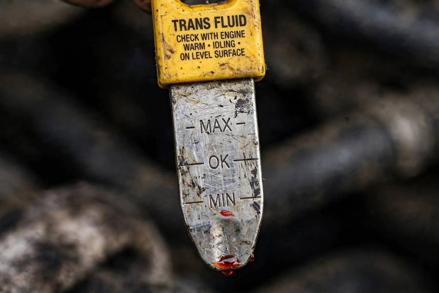 Transmission dipstick showing fluid level below the minimum mark