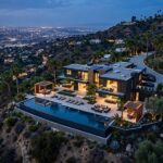 Celebrity Houses: What the Listings Reveal About the Business of Fame Aerial view of a luxury celebrity house in Beverly Hills at dusk