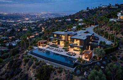 Aerial view of a luxury celebrity house in Beverly Hills at dusk