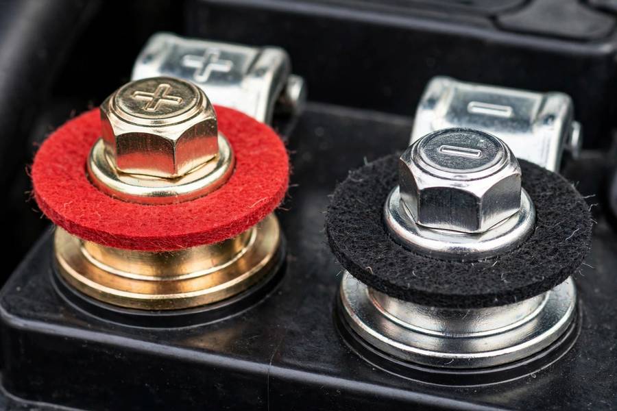 Clean terminals with protective washers after you clean car battery terminals