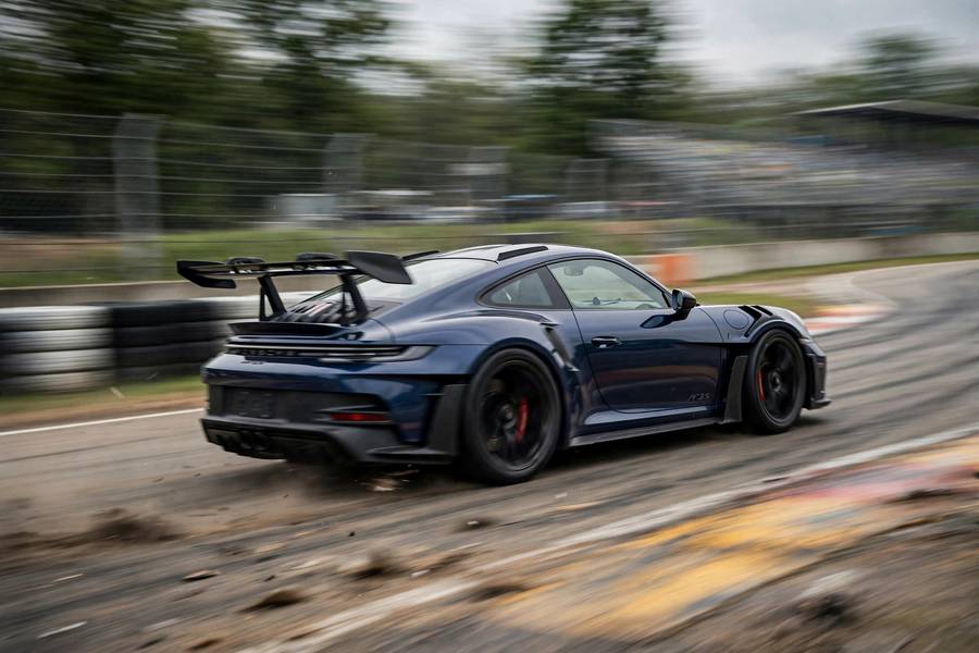 Sports car accelerating hard on a racetrack