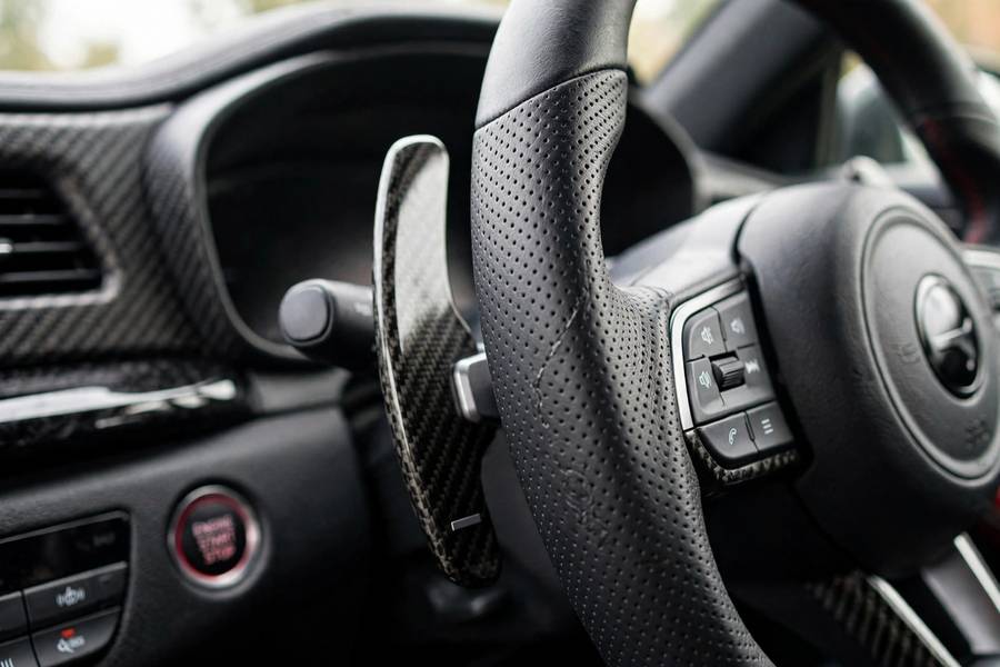 Paddle shifters mounted behind a car's steering wheel