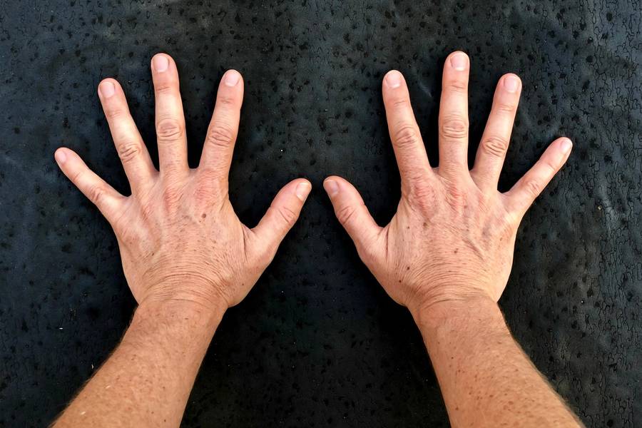Overhead view of correct hand placement for wall handstands