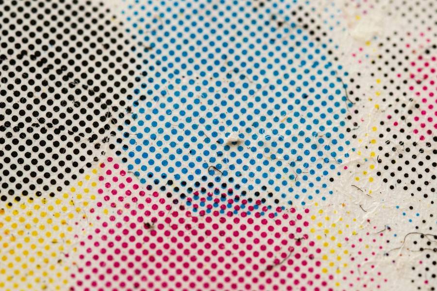 Close-up of ink dots on paper explaining how does a printer work at detail level