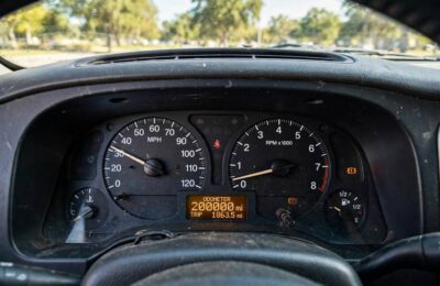Car odometer showing over 200,000 miles on a high-mileage vehicle