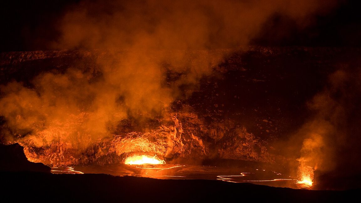 The lava lake of Halemaumau crater at Kilauea, Hawaii, glowing at night during an eruption