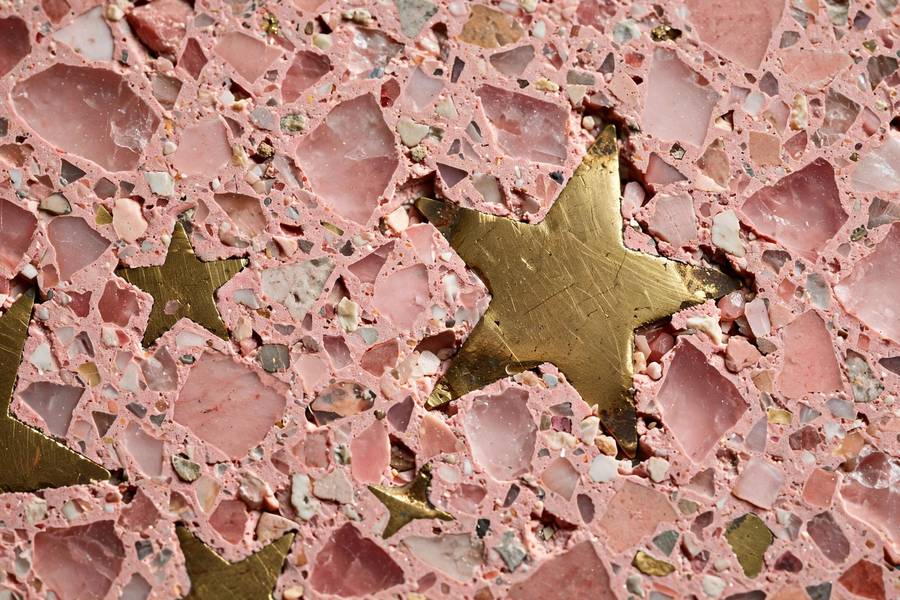 Detailed view of terrazzo and brass star materials