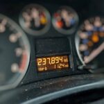 How Often Should You Change Transmission Fluid? Real Intervals, Not Marketing Car odometer showing high mileage on the dashboard