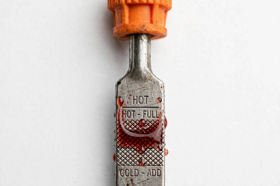 Transmission dipstick showing fluid level at the hot mark