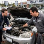 How to Buy a Used Car Without Getting Burned Buyer and mechanic inspecting a used car, the essential step in how to buy a used car safely