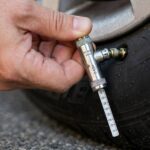 How to Check Tire Pressure With a Gauge: Step-by-Step Reading tire pressure with a pencil gauge in how to check tire pressure step by step gauge