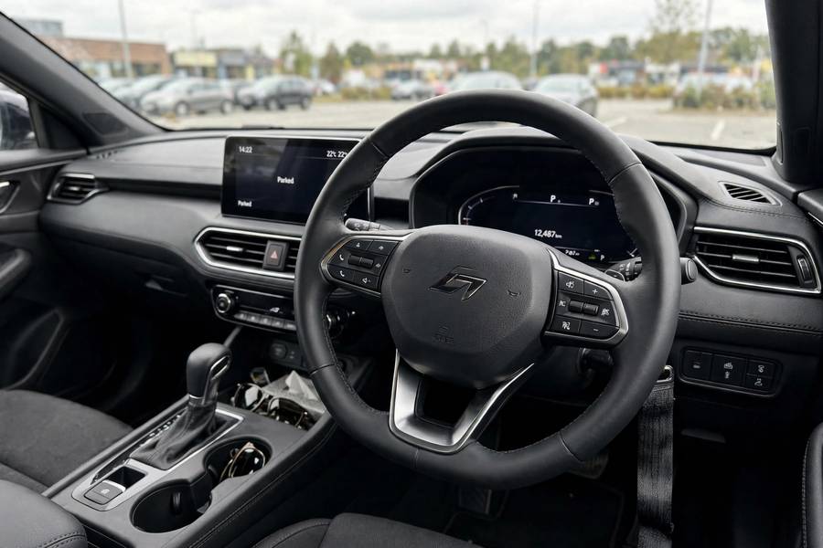 Off-center steering wheel revealing misalignment in home alignment check