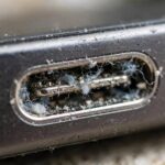 How to Clean iPhone Charging Port Safely (Without Breaking Anything) Lint packed inside an iPhone charging port that needs cleaning before it charges properly