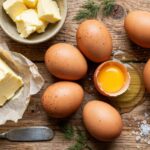 How to Cook Perfect Scrambled Eggs: The Foolproof Method Overhead shot of breakfast ingredients with eggs and butter