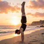 How to Do a Handstand: A Beginner's Step-by-Step Guide Person holding a freestanding handstand on the beach
