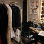 How to Dress Like a Celebrity: The Stylist System, Decoded Stylist's clothing rack showing how to dress like a celebrity behind the scenes