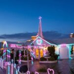 Vegas wedding chapel at night with neon sign