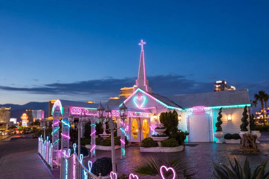 Vegas wedding chapel at night with neon sign