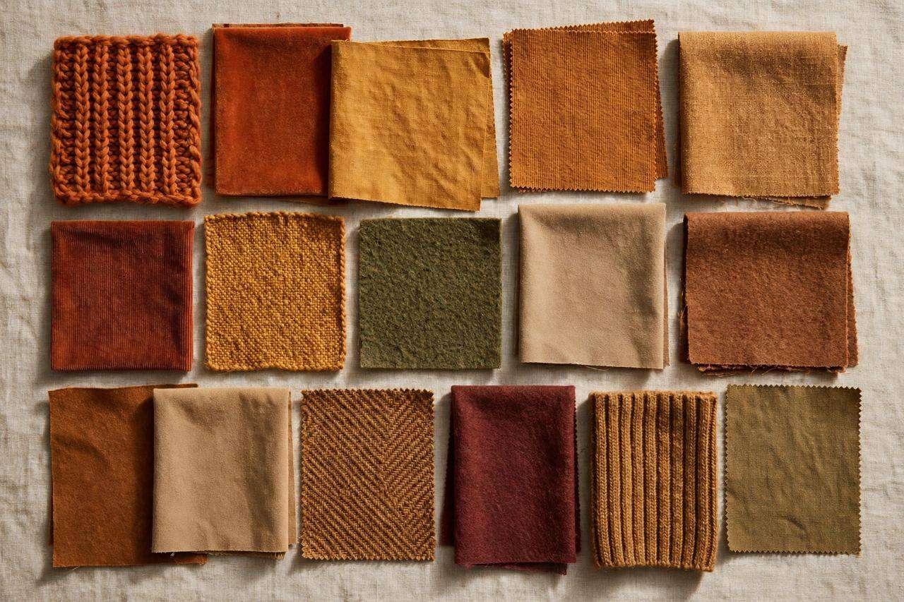 Fabric color swatches in warm autumn tones arranged on a neutral background