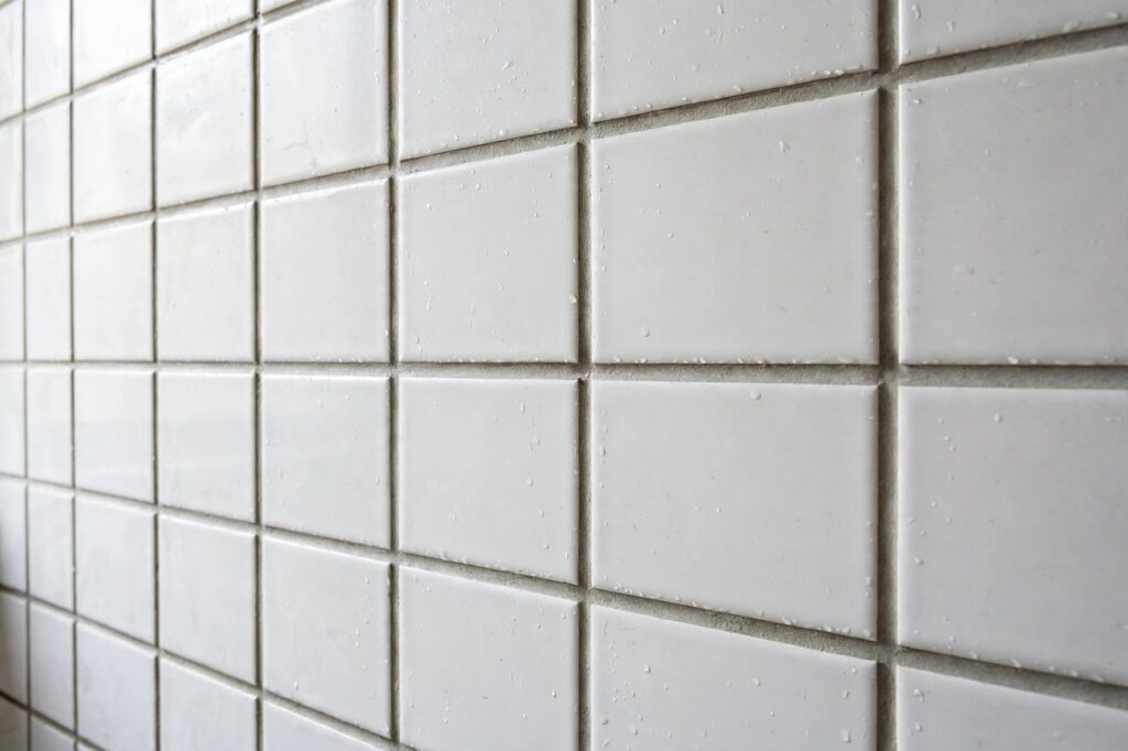 Freshly grouted bathroom tile with clean, even grout lines