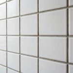 Freshly grouted bathroom tile with clean, even grout lines