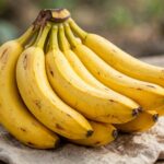 How to Keep Bananas Fresh Longer (My 5 Kitchen Tricks) Bunch of ripe yellow bananas
