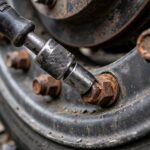 How to Loosen a Stuck Lug Nut: 8 Methods That Work Breaker bar on a stuck lug nut showing how to loosen a stuck lug nut