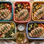 How to Meal Prep for Beginners: Your Friendly Guide to Stress-Free Weekly Meals Overhead view of colorful meal prep containers filled with grains, roasted vegetables, and grilled chicken on a kitchen counter