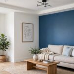 How to Paint a Room Like a Pro: The Complete Step-by-Step Guide Freshly painted living room with crisp white walls and blue accent wall, professional finish