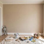 How to Paint a Room Like a Professional: Step by Step A freshly painted living room wall in a warm neutral color with crisp clean edges