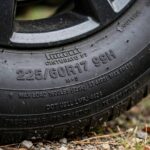 How to Read Tire Sidewall Numbers: A Simple Decoder Guide Close-up of a car tire sidewall showing raised size and rating numbers