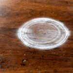 How to Remove Water Stains From Wood Table: Diagnose First, Then Fix White water ring stain on a polished wooden dining table from a cold glass