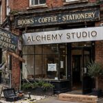 How to Rename an Existing Business Without Losing Customers Replacing old business sign with new name during rebrand