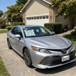 How to Sell a Car: Get Top Dollar Without the Hassle Car with for-sale sign in driveway, the first step in how to sell a car privately