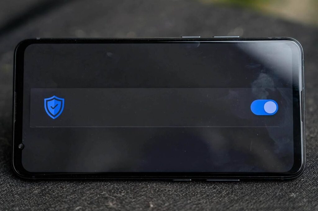 Android phone screen showing spam protection toggle in Google Messages settings